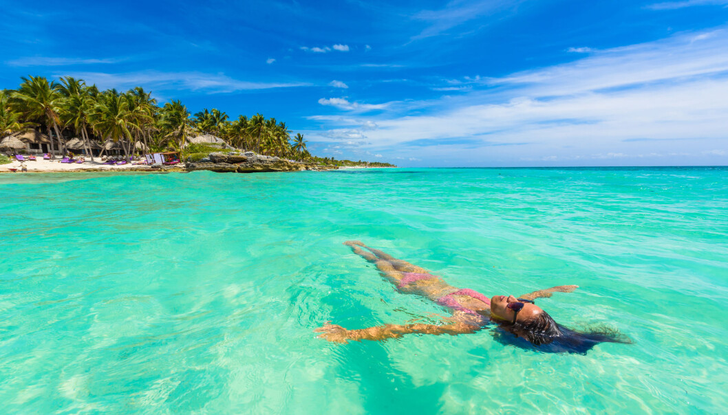 Ferie i varme land kan gjøre de varme landene enda varmere. Turisme er nemlig skyld i veldig store utslipp av drivhusgasser. (Foto: Simon Dannhauer / Shutterstock / NTB scanpix) Ferie i varme land kan gjøre de varme landene enda varmere. Turisme er nemlig skyld i veldig store utslipp av drivhusgasser. (Foto: Simon Dannhauer / Shutterstock / NTB scanpix)