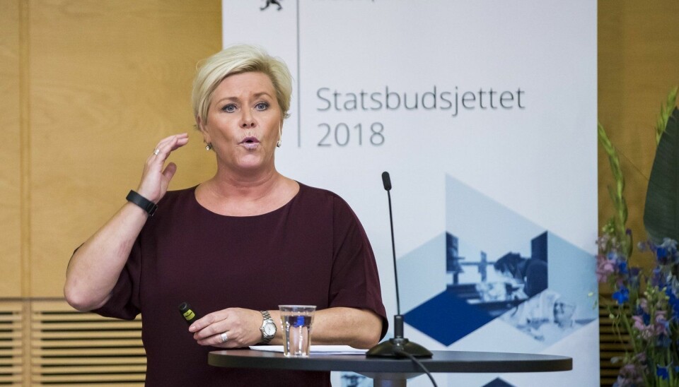 Finansminister Siv Jensen (Frp) holder pressekonferanse om statsbudsjettet 2018 i plenumssalen torsdag.  (Foto: Heiko Junge / NTB scanpix)