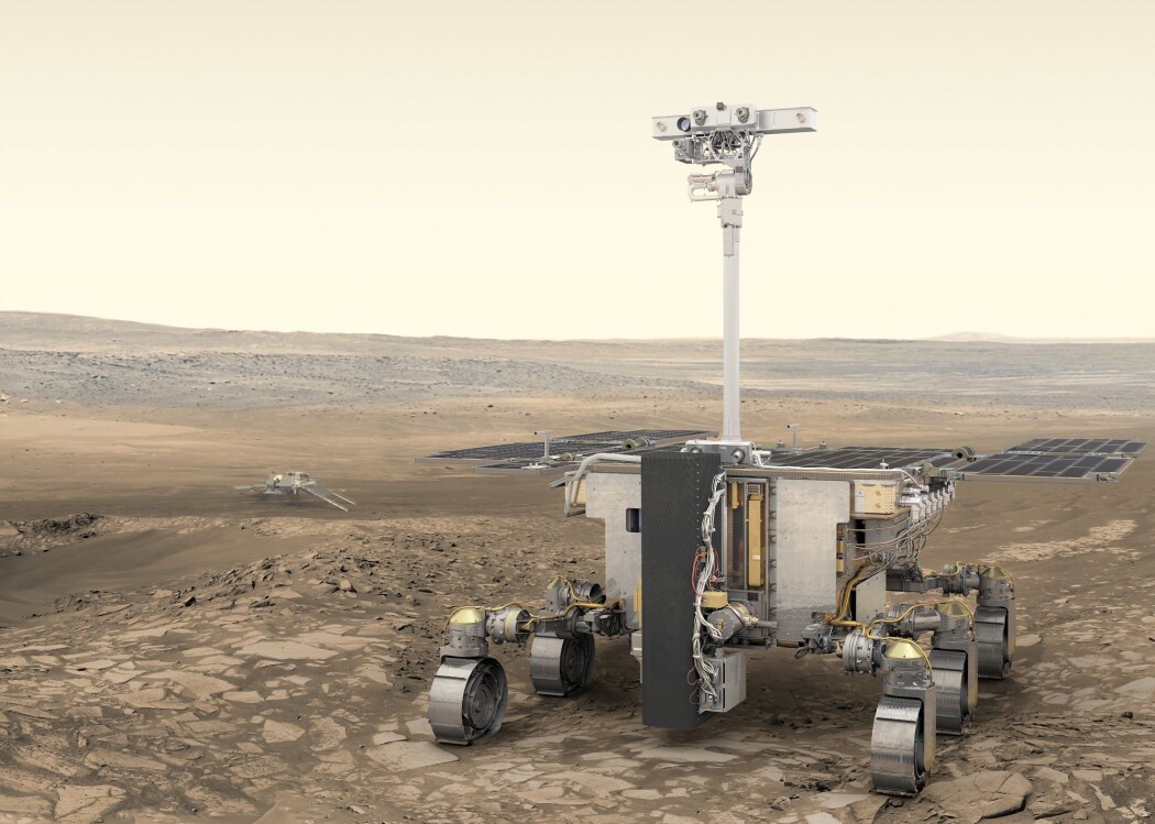 Forskere har nå bestemt hvor den nye roveren skal lete etter vann. Illustrasjonen viser ExoMars-roveren med den russiske landingsplattformen i bakgrunnen. (Illustrasjon: ESA) Forskere har nå bestemt hvor den nye roveren skal lete etter vann. Illustrasjonen viser ExoMars-roveren med den russiske landingsplattformen i bakgrunnen. (Illustrasjon: ESA)