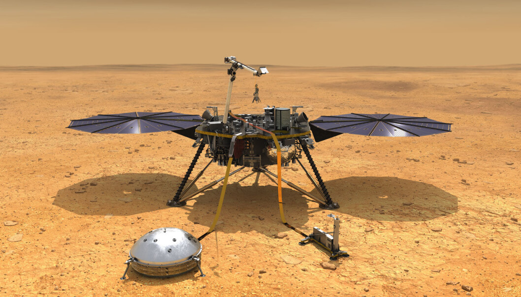 Det lille runde instrumentet i forgrunnen er seismometeret på InSight. Hvis alt går etter planen skal det registrere alle bevegelser i bakken i de neste to årene. (Illustrasjon: NASA/JPL-Caltech) Det lille runde instrumentet i forgrunnen er seismometeret på InSight. Hvis alt går etter planen skal det registrere alle bevegelser i bakken i de neste to årene. (Illustrasjon: NASA/JPL-Caltech)