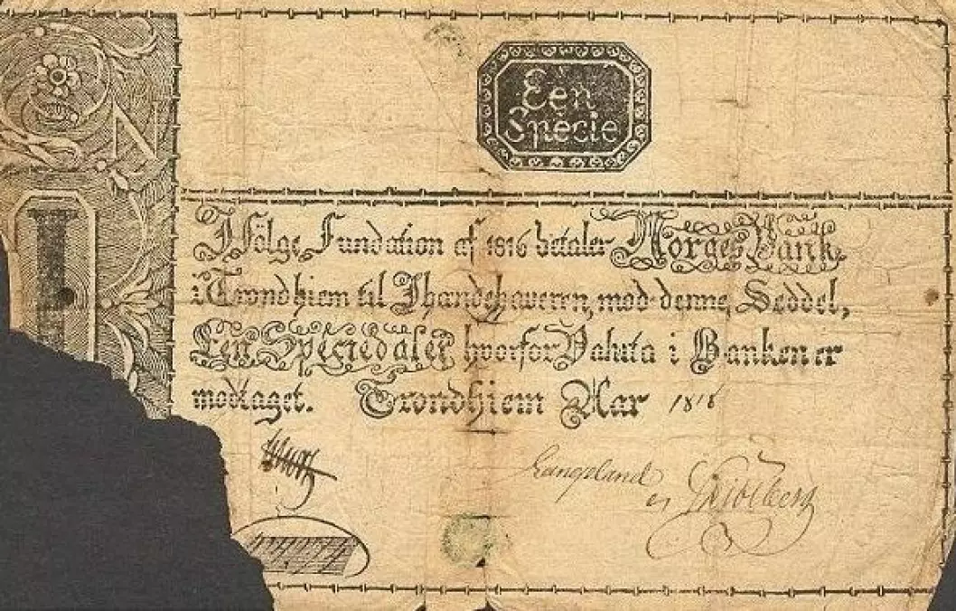 Slik så de første norske pengesedlene ut. 1 speciedaler utgitt av Norges Bank i Trondheim i 1818.