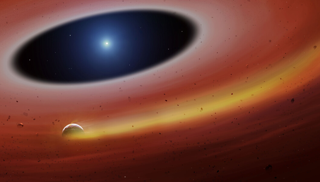 En kunstner ser for seg den lille planeten eller planetfragmentet som går i bane rundt den hvite dvergen En kunstner ser for seg den lille planeten eller planetfragmentet som går i bane rundt den hvite dvergen