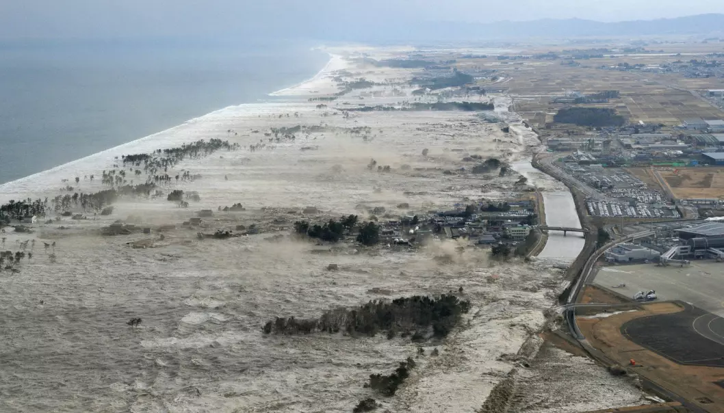 Her treffer tsunamien i 2011 den japanske kystlinjen. Bildet er fra Iwanuma, det samme området som de eldre som deltok i forsøket bodde i. (Foto: Kyodo/Reuters/NTB Scanpix)