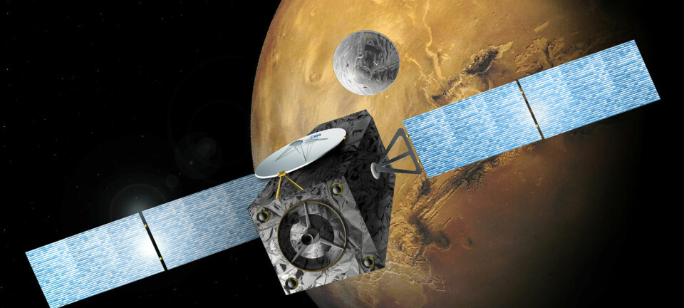 En illustrasjon laget av ESA viser Mars-sonden Trace Gas Orbiter (TGO) og landingsfartøyet Schiaparelli like etter at de to er koblet fra hverandre.  (Foto: Handout / Reuters / NTB scanpix)