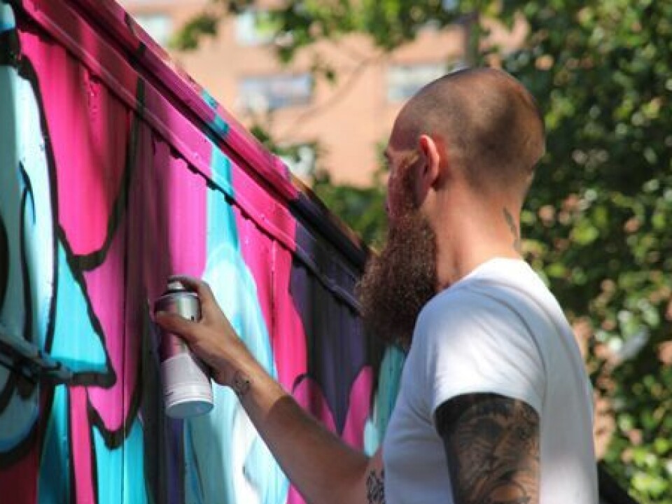The graffiti artist BISHOP 203 in action. (Photo: Carl Petter Opsahl)