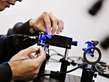 Albert Tsao examines a laser used by researchers to send light pulses along an optical fibre into their study subjects’ brains. (Photo: Geir Mogen, NTNU) Albert Tsao examines a laser used by researchers to send light pulses along an optical fibre into their study subjects’ brains. (Photo: Geir Mogen, NTNU)