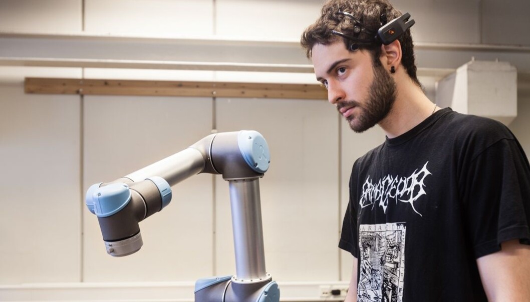 Student Angel Garcia use his eyes, eyebrows and other parts of his face to make the robot move. (Photo: Thor Nielsen) Student Angel Garcia use his eyes, eyebrows and other parts of his face to make the robot move. (Photo: Thor Nielsen)