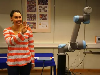 Signe Moe's task has been to find out how a robot can be trained to imitate human movements. She has solved this using a system by which she guides the robot using a Kinect camera typically used in games technology. (Photo: Morten Gunnerud)