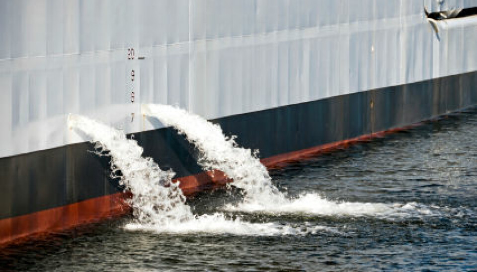 A ship pumps out ballast water when taking on cargo. (Photo: iStockphoto)