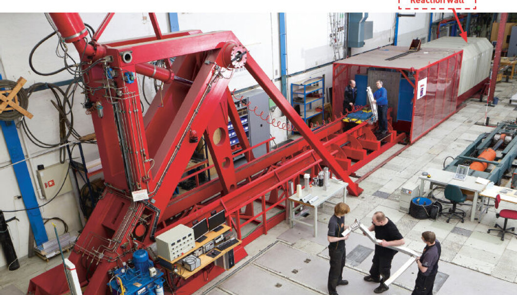 The two-storey bright red “Kicking Machine” is so powerful it needs a 150,000 tonne reaction wall behind it to absorb the force of its blow. (Photo. SIMLab) The two-storey bright red “Kicking Machine” is so powerful it needs a 150,000 tonne reaction wall behind it to absorb the force of its blow. (Photo. SIMLab)