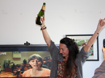 May-Britt Moser, newly named a Nobel laureate, celebrates after the prize is announced. Juleen Zierath, chairman of the Nobel Committee for Physiology or Medicine, discusses the award on the TV behind May-Britt. (Photo: Nancy Bazilchuk, NTNU) May-Britt Moser, newly named a Nobel laureate, celebrates after the prize is announced. Juleen Zierath, chairman of the Nobel Committee for Physiology or Medicine, discusses the award on the TV behind May-Britt. (Photo: Nancy Bazilchuk, NTNU)