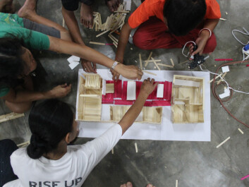Involving the future residents of the housing project is an important part of the development process. Here, the children in Streetlight help build models of the houses that are being rebuilt— the ones that they are going to live in. (Photo: Workshop/NTNU) Involving the future residents of the housing project is an important part of the development process. Here, the children in Streetlight help build models of the houses that are being rebuilt— the ones that they are going to live in. (Photo: Workshop/NTNU)