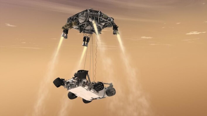 6. august 2012 landet roveren Curiosity på Mars ved å fire seg selv ned til bakken fra en svevende kran. Slik skal Mars2020 også lande i 2021. (Foto: (Illustrasjon: NASA/JPL-Caltech)) 6. august 2012 landet roveren Curiosity på Mars ved å fire seg selv ned til bakken fra en svevende kran. Slik skal Mars2020 også lande i 2021. (Foto: (Illustrasjon: NASA/JPL-Caltech))