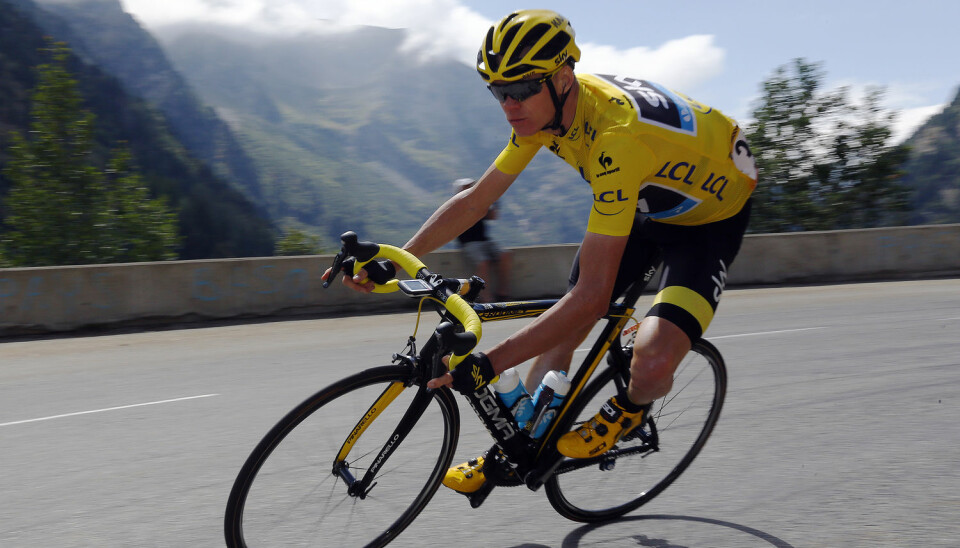 Team Sky rider Chris Froome of Britain wears the race leader's yellow jersey as he speeds downhill during the 110.5-km (68.6 miles) 20th stage of the 102nd Tour de France cycling race from Modane to Alpe d'Huez in the French Alps mountains, France, in this picture taken July 25, 2015. (Photo: Stefano Rellandini, Reuters, NTB scanpix)