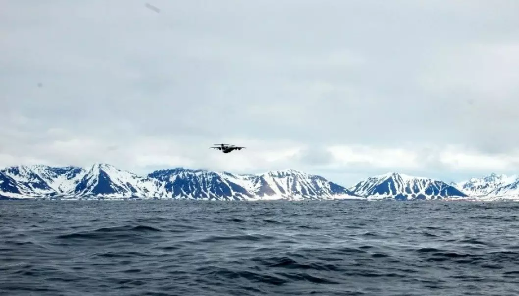 The FAAM research aircraft BAe 146 in the air over Prins Karls Forland on the west coast of Svalbard. (Photo: CAGE)
