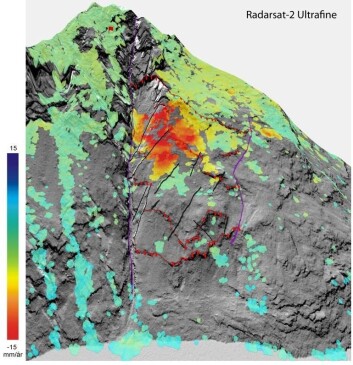 InSAR-kart av Åkneset (fjellet fra "Bølgen") basert på data fra Radarsat-2. De røde stiplede linjene viser sprekker som forskerne har tegnet inn, mens de oransje og røde flekkene viser hvor utglidningen er størst. De rødeste partiene viser en utglidning/nedsynking på 15 mm per år. (Foto: NGU/Norut) InSAR-kart av Åkneset (fjellet fra "Bølgen") basert på data fra Radarsat-2. De røde stiplede linjene viser sprekker som forskerne har tegnet inn, mens de oransje og røde flekkene viser hvor utglidningen er størst. De rødeste partiene viser en utglidning/nedsynking på 15 mm per år. (Foto: NGU/Norut)