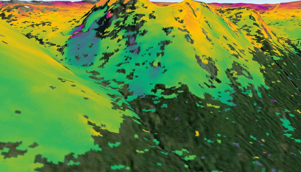 «SAR interferometry» kan brukes til å spå hvor det er risiko for jordskred - her i Kåfjord i Troms. Området på bildet er kjent som ustabilt. Sentinel-1A- radaren skannet området 23. september og 30. august 2014. Der bildet viser blå skygger langs fjellsiden, har underlaget beveget seg omtrent én centimeter i denne perioden. Norske myndigheter bruker teknikken over hele landet for å kunne beregne skredrisiko. (Foto: ESA)