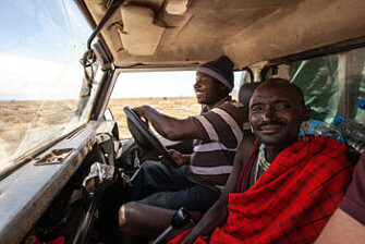 Onesmo, left, a driver and field technician on the African wild dog project, and a Maasi man out on the job. (Photo: Per Harald Olsen, NTNU) Onesmo, left, a driver and field technician on the African wild dog project, and a Maasi man out on the job. (Photo: Per Harald Olsen, NTNU)