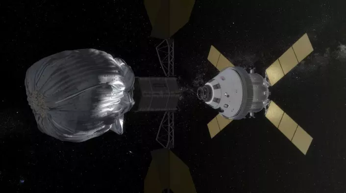 NASAs Orionkapsel med fire astronauter nærmer seg det ubemannede romskipet med den innfangede asteroiden i en sekk. (Foto: (Illustrasjon: NASA))