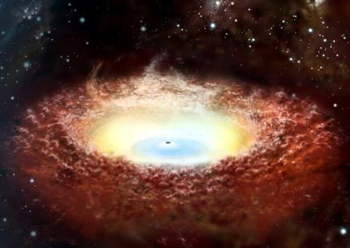 Et kjempemessig svart hull som sitter i midten av en galakse har en stor sky av materiale rundt seg. JAXA