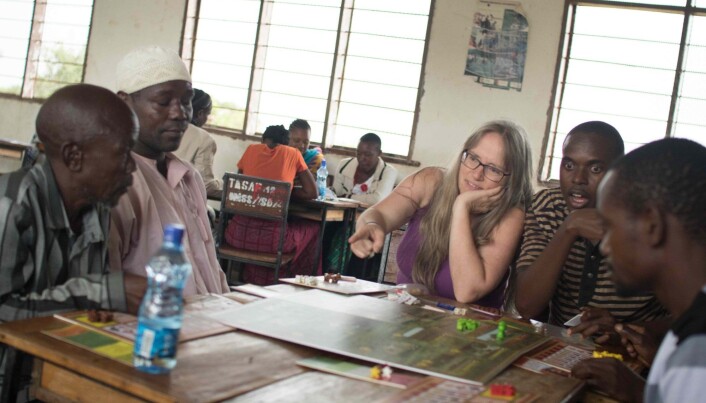 Bente Jessen Graae points as she talks to players about the Savanna Life board game. Bente Jessen Graae points as she talks to players about the Savanna Life board game.
