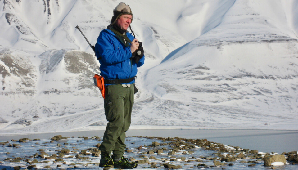Bjørn Munro Jenssen out in the field in Svalbard. Like all field researchers on the Norwegian archipelago, he has to carry a rifle and a flare gun because of the risk of polar bear attack.