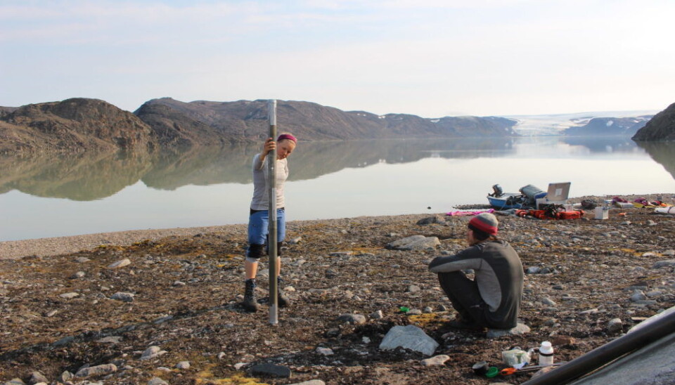 Sofia Kjellman collecting sediment cores in Svalbard as part of her PhD research. She sometimes works in remote locations that can only be reached by helicopter.