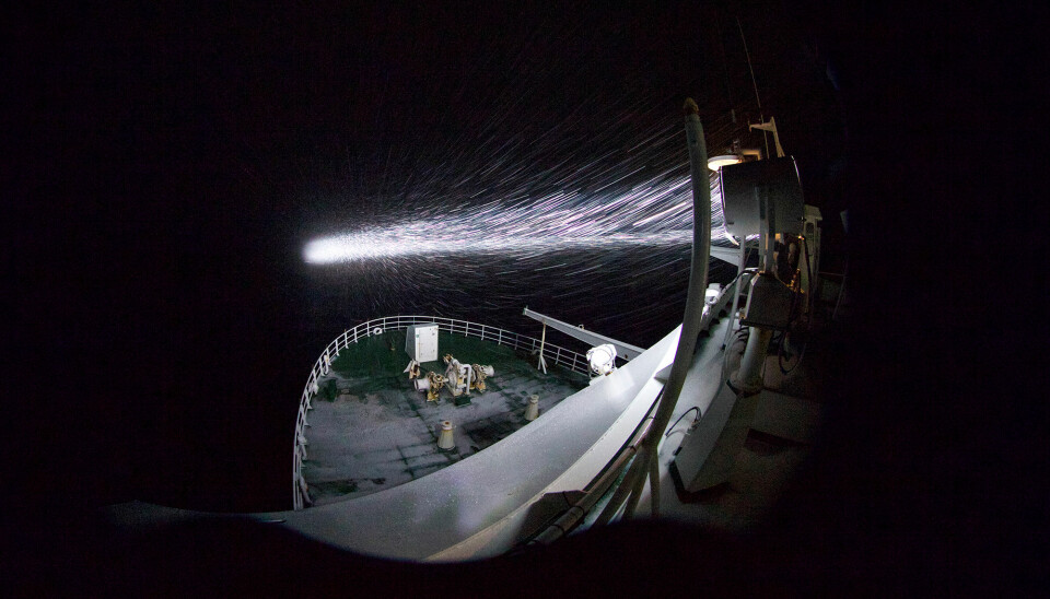 Just how dark is dark? The lights from the research ship illuminate blowing snow, but outside of that, the area looks dark — to human eyes, anyway, but not to creatures that are adapted to the polar night.