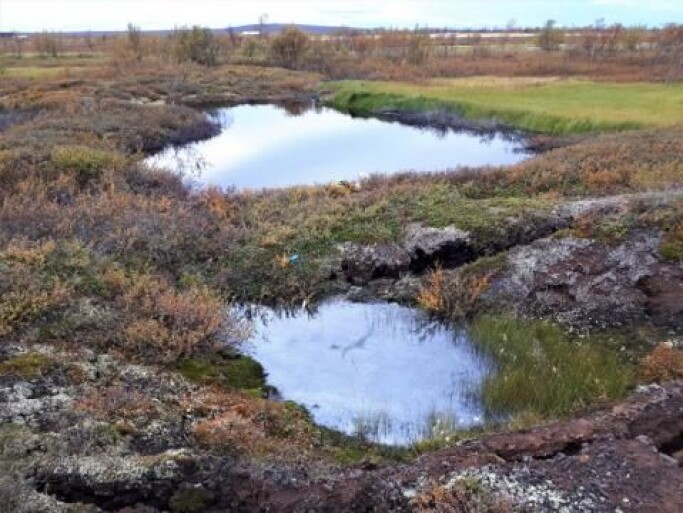 Thawing permafrost and thermokarst processes have made ponds in this peatland landscape in Northern Norway. In the PERMANOR project these processes are systematically mapped with a drone over several years. The small pond in the foreground is only a few months old, while the other has grown considerably during the last four years. Thawing permafrost and thermokarst processes have made ponds in this peatland landscape in Northern Norway. In the PERMANOR project these processes are systematically mapped with a drone over several years. The small pond in the foreground is only a few months old, while the other has grown considerably during the last four years.