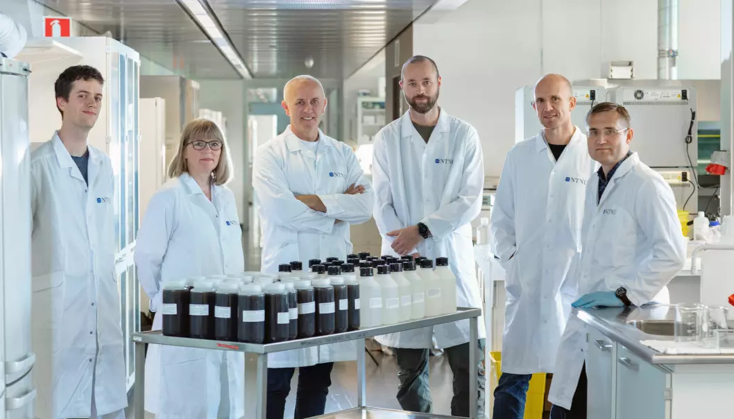 The table in front of the COVID-19 team at the Department of Clinical and Molecular Medicine contains 1.5 million tests. From left, Erlend Ravlo, staff engineer; Hilde Lysvand, senior engineer; Magnar Bjørås, professor and team leader; Sten Even Erlandsen, senior engineer; Lars Hagen, general manager, Proteomics and Modomics Experimental Core Facility (PROMEC); and Per Arne Aas, senior engineer.