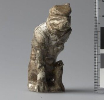A six-centimetre tall figurine that possibly portrays a bear. It was found in a tomb in Østre Alm, Hedmark county, with two other, smaller game pieces. The bear figurine was probably used as the main piece in a game of hnefatafl. A six-centimetre tall figurine that possibly portrays a bear. It was found in a tomb in Østre Alm, Hedmark county, with two other, smaller game pieces. The bear figurine was probably used as the main piece in a game of hnefatafl.