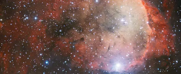 Hulrommet i stjernetåken Carina fotografert fra et av ESOs observatorier i Chile. Noen mener kanten av hulrommet minner om et portrett av den kvinnelige chilenske poeten Gabriela Mistral i profil. (Foto: ESA)