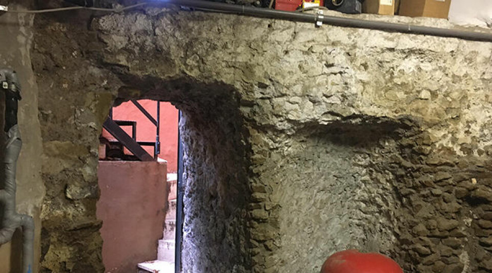 A glimpse of the modern staircase through the ancient aqueduct ruins in the basement of the Norwegian institute in Rome.
