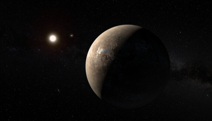 I vårt nærmeste stjernesystem ligger planeten Proxima b. Her illustrert av en kunstner. I vårt nærmeste stjernesystem ligger planeten Proxima b. Her illustrert av en kunstner.