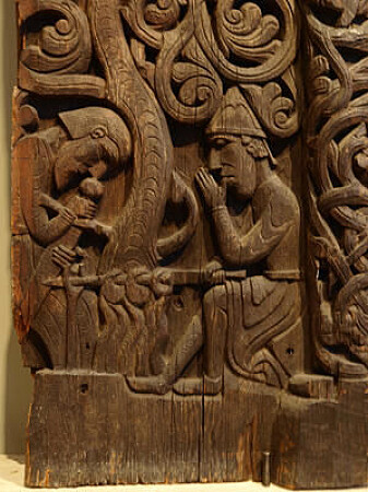 From the Hylestad stavechurch (Norway), this scene shows Sigurðr roasting the dragon's heart. After sucking his finger with the blood on, he was able to understand the speech of birds. From the Hylestad stavechurch (Norway), this scene shows Sigurðr roasting the dragon's heart. After sucking his finger with the blood on, he was able to understand the speech of birds.