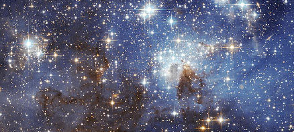 "Dette bildet fra romteleskopet Hubble viser for første gang svake nyfødte stjerner i Den store magellanske sky. Foto: ESA/NASA"