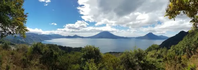 Lake Atitlán covers 127.7 square kilometers. The lake occupies a valley dammed by volcanic ash, it is 320 meters deep, 19 kilometers long and 10 kilometers wide (Britannica).