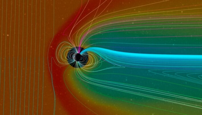 En modell som viser magnetfeltet rundt jorda (sirkelen i midten) , og hvordan det bøyer av kraftig solvind, som er representert ved det røde fargen. Magnetfeltene er representert ved alle linjene. Solvinden kommer altså fra venstre. En modell som viser magnetfeltet rundt jorda (sirkelen i midten) , og hvordan det bøyer av kraftig solvind, som er representert ved det røde fargen. Magnetfeltene er representert ved alle linjene. Solvinden kommer altså fra venstre.