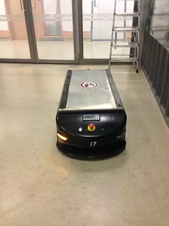 This rectangular box on wheels is a robot that transports trolleys around the hospital. Surprisingly, when people hear it talk, they see it as a kind of funny animal-like creature — and not really a robot.