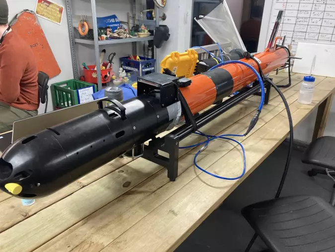 The star of the show: The lightweight autonomous underwater vehicle on a workbench, before deployment.