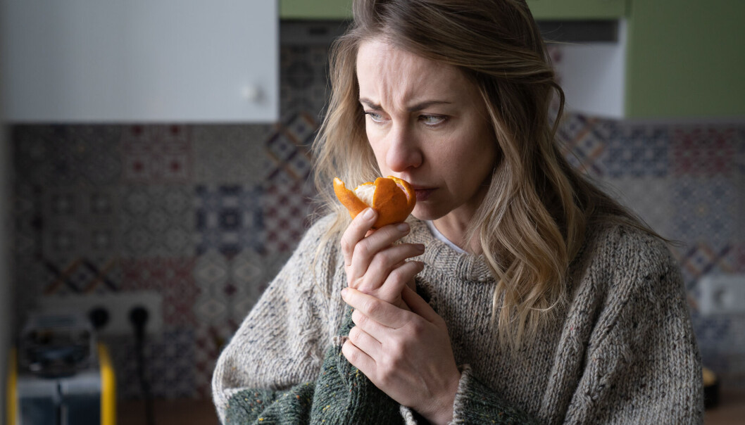 Sick,Woman,Trying,To,Sense,Smell,Of,Fresh,Tangerine,Orange, Sick,Woman,Trying,To,Sense,Smell,Of,Fresh,Tangerine,Orange,
