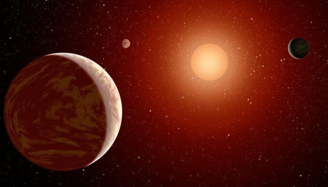 Slik ser en kunstner for seg at et planetsystem rundt en rød dvergstjerne kan se ut Slik ser en kunstner for seg at et planetsystem rundt en rød dvergstjerne kan se ut