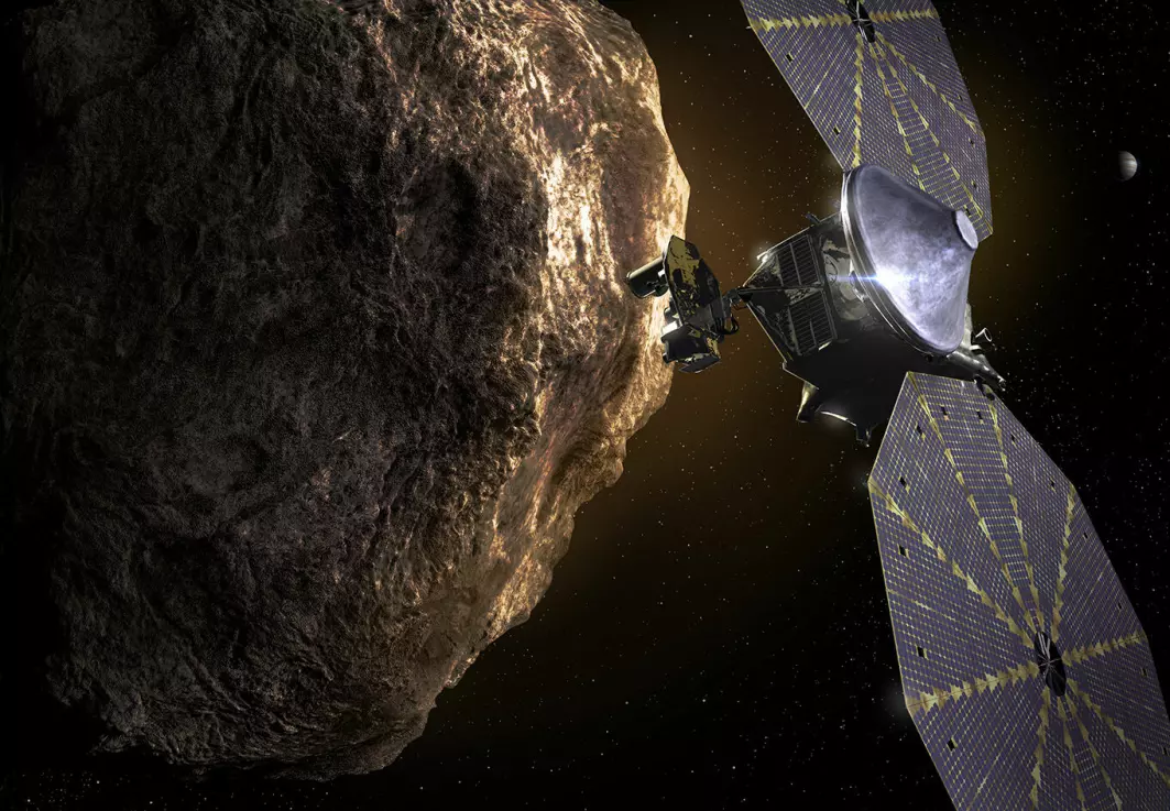 Slik ser en kunstner for seg at det ser ut når Lucy-sonden undersøker asteroidene kjent som Jupitertrojanerne.