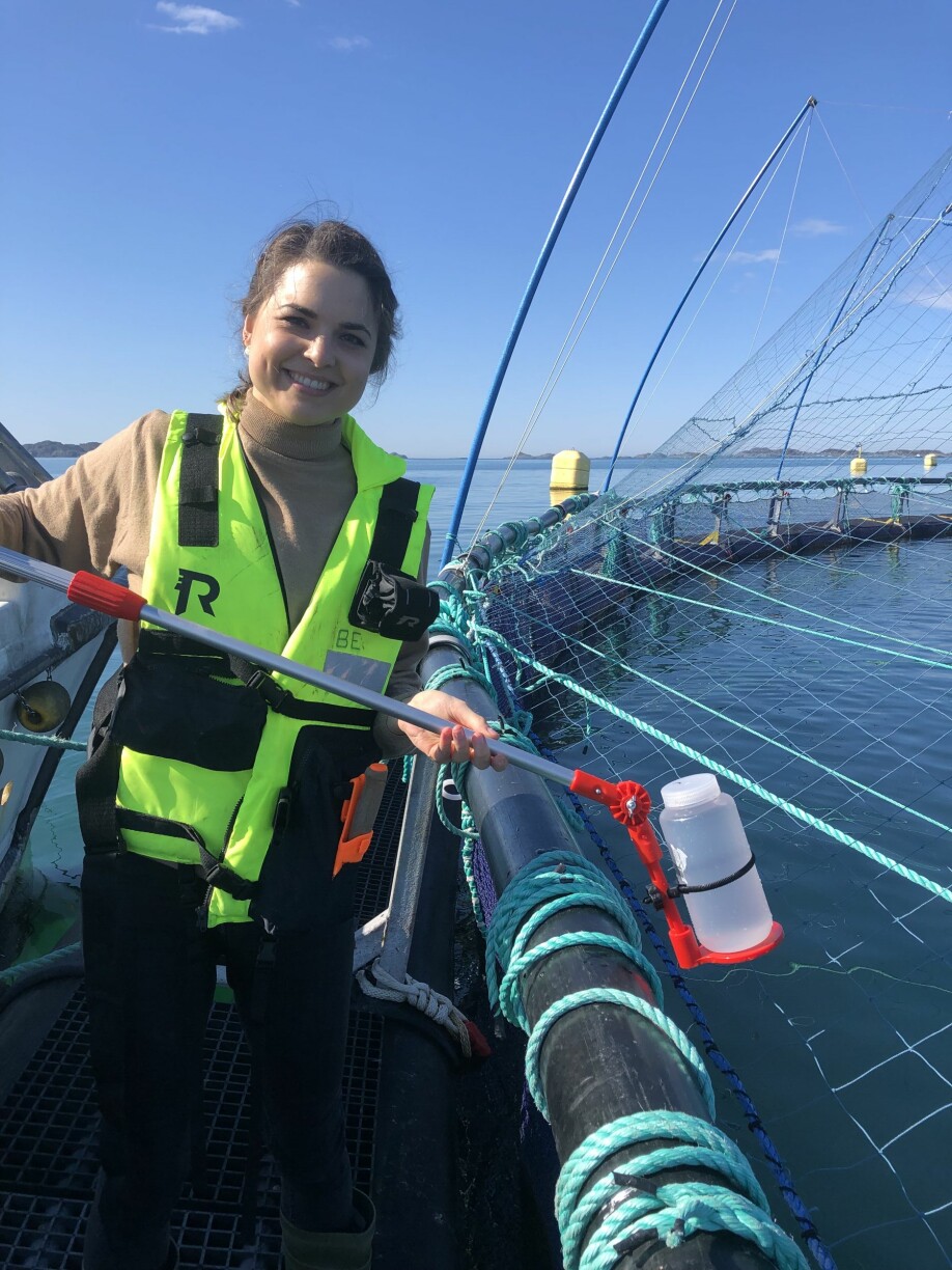 Lisa-Victoria Bernhardt demonstrates a 1 L water bottle attached to a telescopic swing sampler that was used to collect the water samples from the top layer within each net-pen. This approach was used during the more comprehensive field study, which demonstrated earlier SAV detection in the water samples compared to the fish samples collected in connection with the surveillance program for SAV/PD.