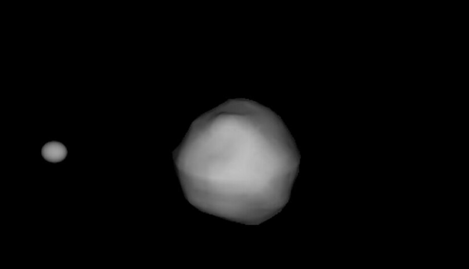 Et datagenerert bilde av dobbeltasteroiden, basert på blant annet radarmålinger. DART skal krasje inn i asteroiden til venstre i bildet, som er rundt 165 meter i diameter. Den går i bane rundt en større asteroide kalt Didymos, i midten av bildet.