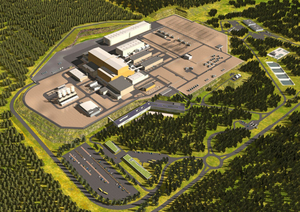 Slik vil det ferdigbyggede ITER se ut. Den store, orange bygningen i midten er Tokamak-hallen. (Illustrasjon: ITER Organization)