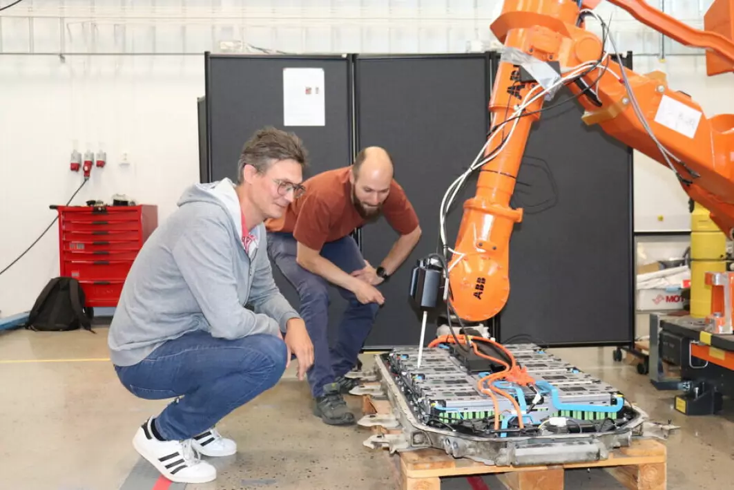 Ilya Tyapin (left) and Martin Choux check that the fine-tuned robot gripper works as it should.