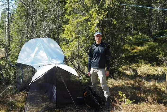 Professor Torbjørn Ekrem with a malaise trap that is used to catch insects.