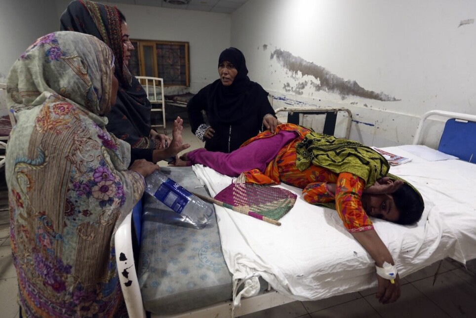 A pregnant woman lies in her hospital bed for treatment after fleeing her flood-hit home Pakistan, September 8 2022. Pregnant women are struggling to get care after Pakistan’s unprecedented flooding, which inundated a third of the country at its height and drove millions from their homes.
