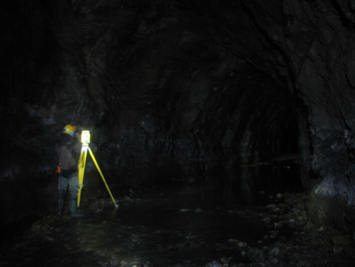Alex with the total station measuring the traverse along the water tunnel. Alex with the total station measuring the traverse along the water tunnel.
